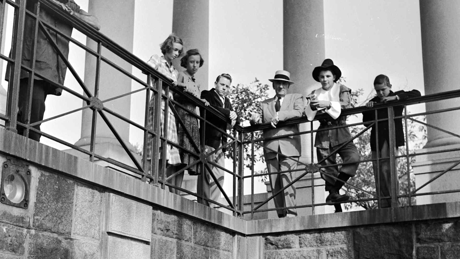 circa 1950: Visitors viewing the Plymouth Rock enshrined in a Grecian Temple by the Colonial Dames in 1920. The rock is supposed to be where the first American settlers landed. (Photo by Douglas Grundy/Three Lions/Getty Images)