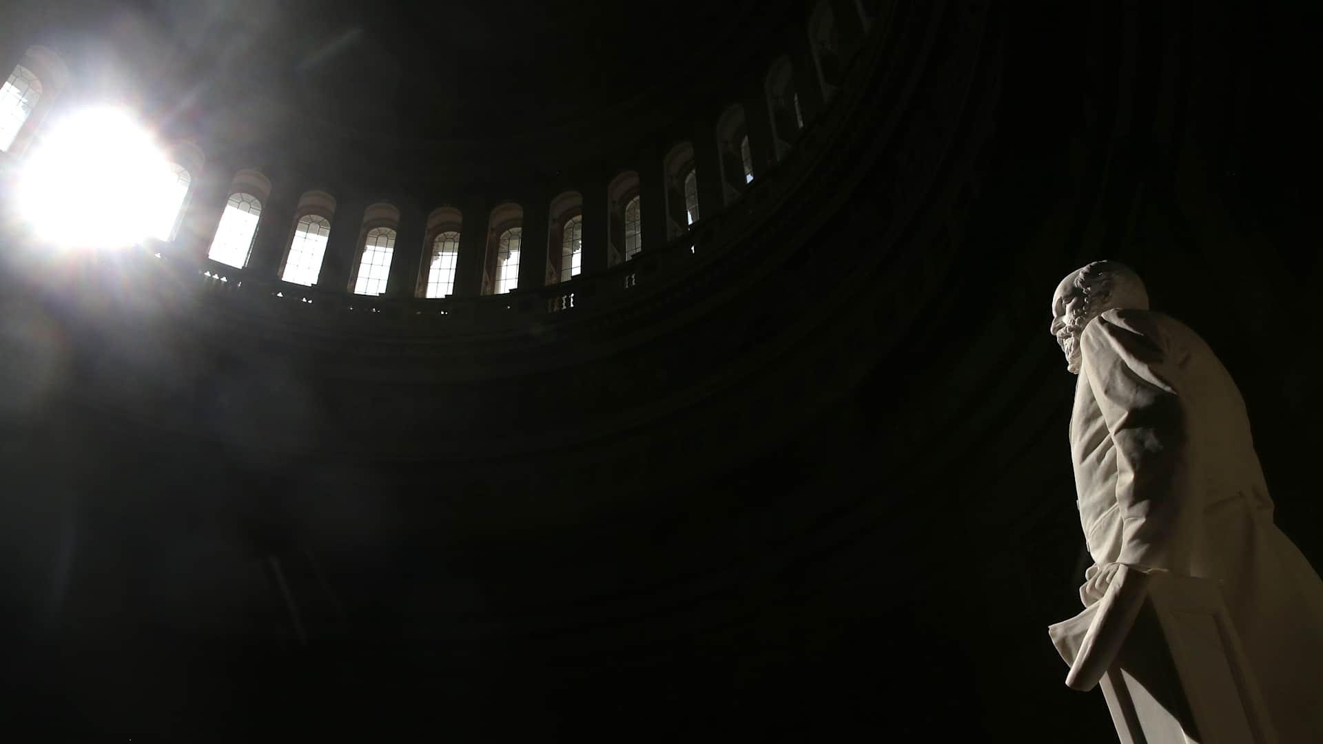 A statue of the 20th U.S. President, James A. Garfield stands inside the Capitol Rotunda as sunlight shines through the window, on February 20, 2014 in Washington, DC.