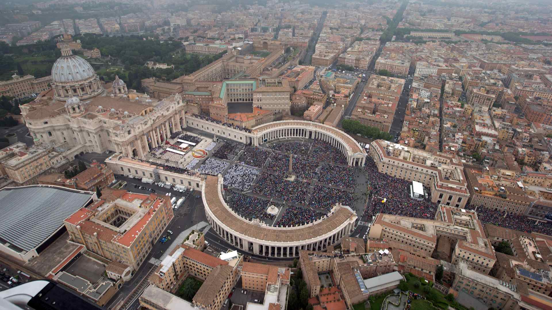 An aerial view of St. Peter's Square and Via della Conciliazione in Vatican City.