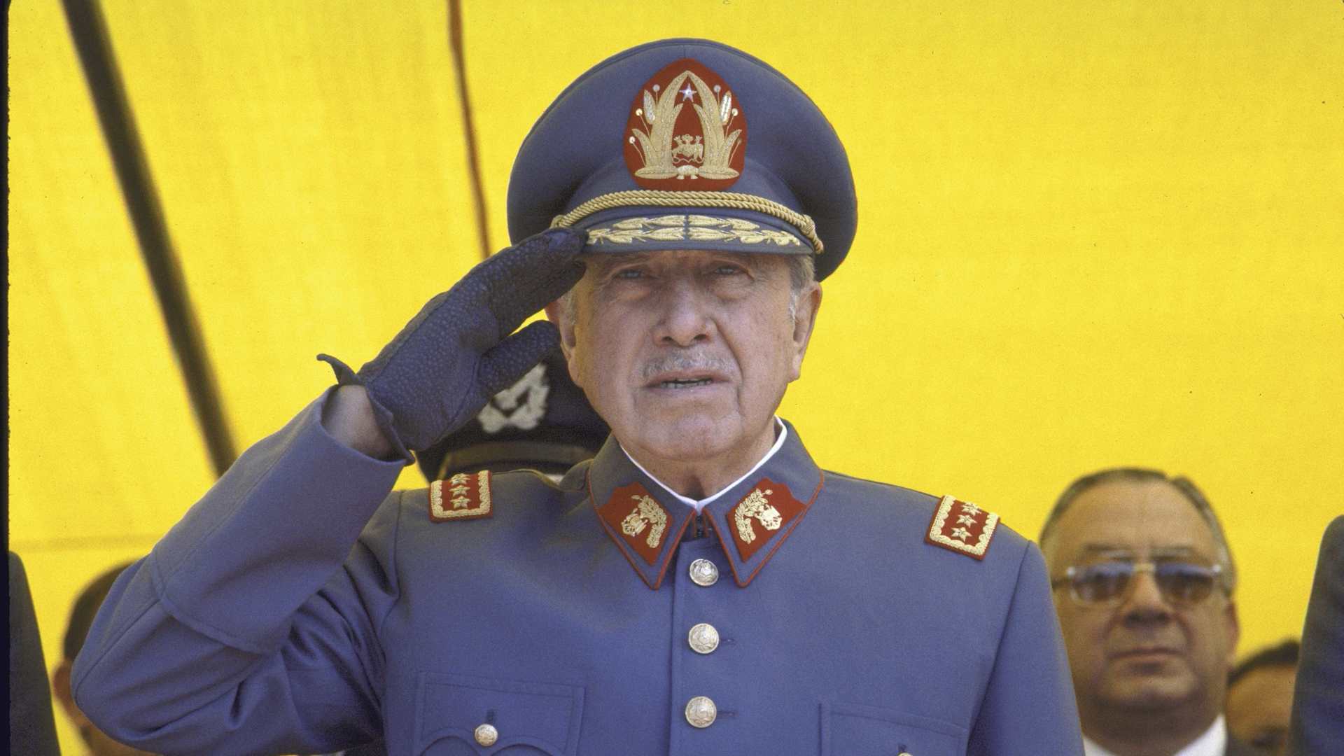 Chilean Leader Augusto Pinochet, in a close-up as he salutes.