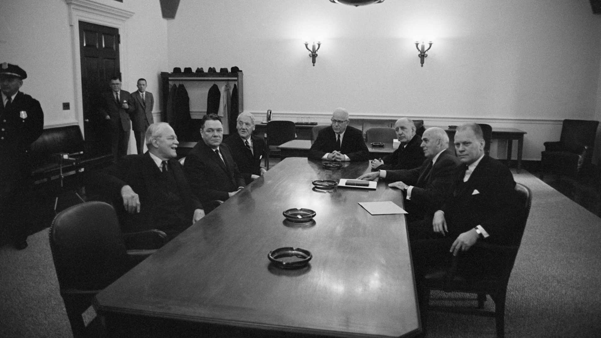 Chief Justice Earl Warren and other Washington luminaries at a table. The Warren Commission was appointed by President Johnson to investigate the assassination of John F. Kennedy.