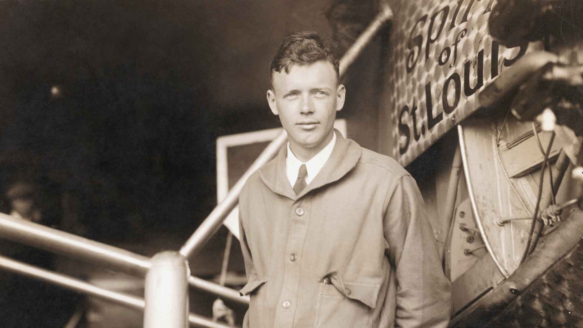 Charles Lindbergh (1902-1974), American aviator. He is seen here posing by the plane in which he completed the first nonstop solo flight across the Atlantic, the Spirit of St. Louis.