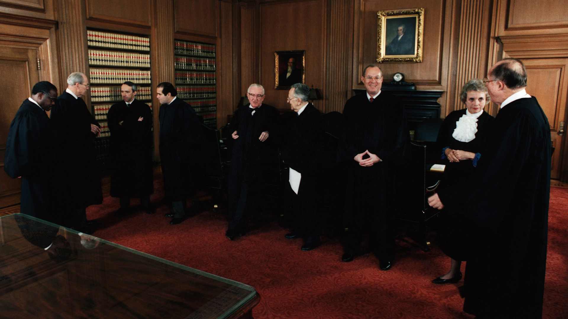 November 1991: Chief Justice of the U.S. Supreme Court William Rehnquist and the newly installed Associate Justice Clarence Thomas (l) in the Supreme Court building. All nine Supreme Court Justices are shown.