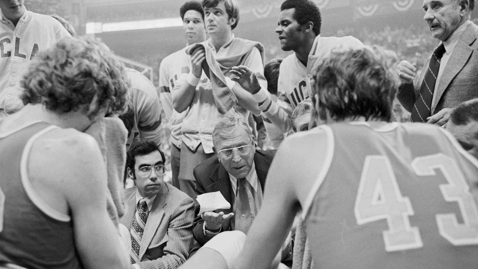 John Wooden (center), shown in the 1974 NCAA Tournament title game, coached UCLA to 10 championships./ Rich Clarkson / NCAA Photos via Getty Images
