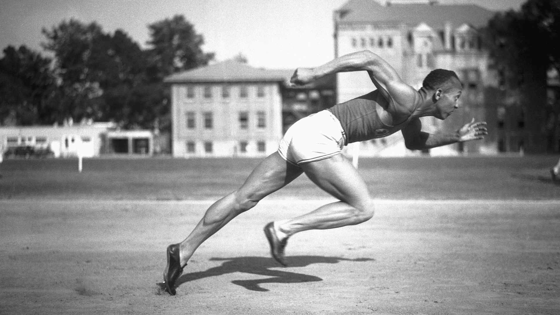 Jesse Owens, Ohio State's sensational athlete, is shown in the midst of running a sprint circa 1935.