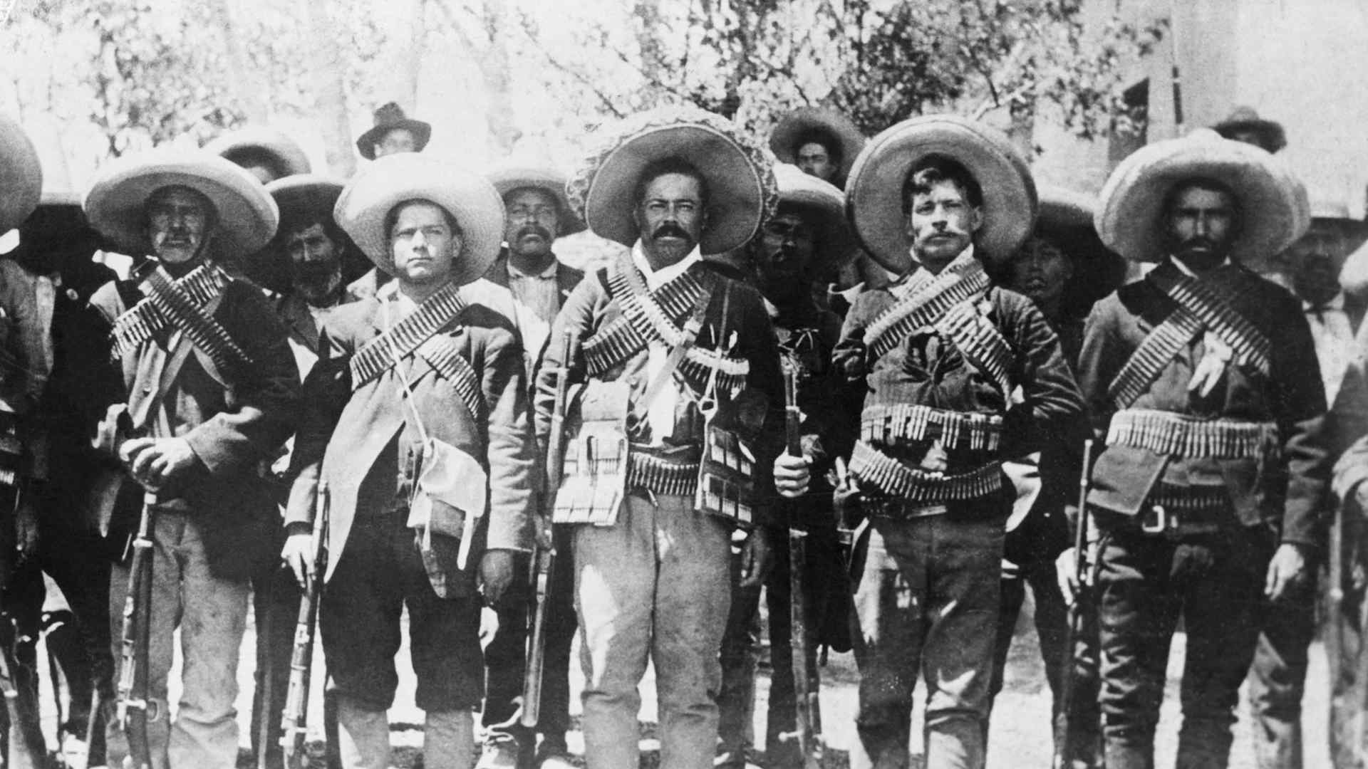 (Original Caption) Ca. 1909-1920-Pancho Villa (1878-1923), Mexican bandit and revolutionary leader, lined up with some of his followers.