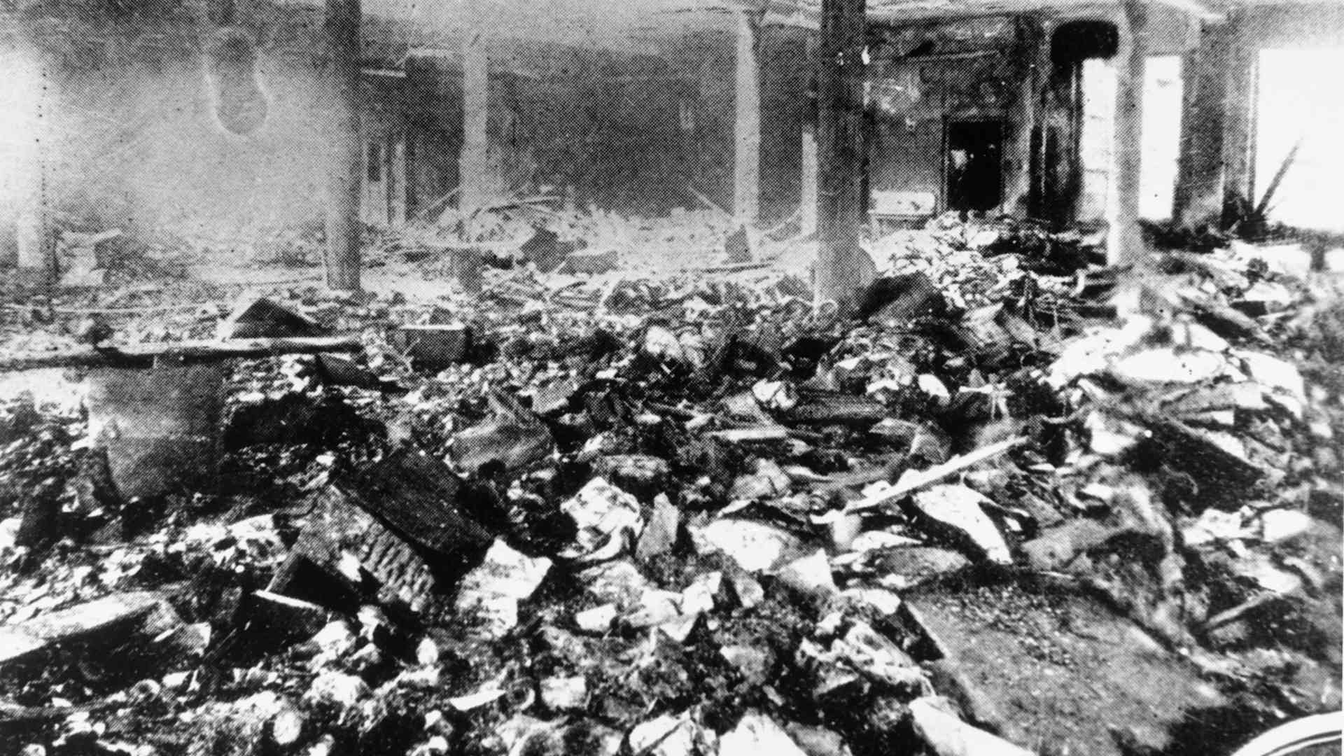 On March 25, 1911, 146 immigrant garment workers were killed after they were trapped on the upper floors of the Asch Building after the Triangle Shirtwaist Factory caught fire. The owners of the factory had chained shut the exit doors, and the workers, who were mostly young women, perished in the fire or died after jumping from the ten story building. A sidewalk cellar's skylight was shattered by the fallen bodies of panic stricken workers. This photo shows the gutted remains of the tenth floor, with only the floors and walls intact.