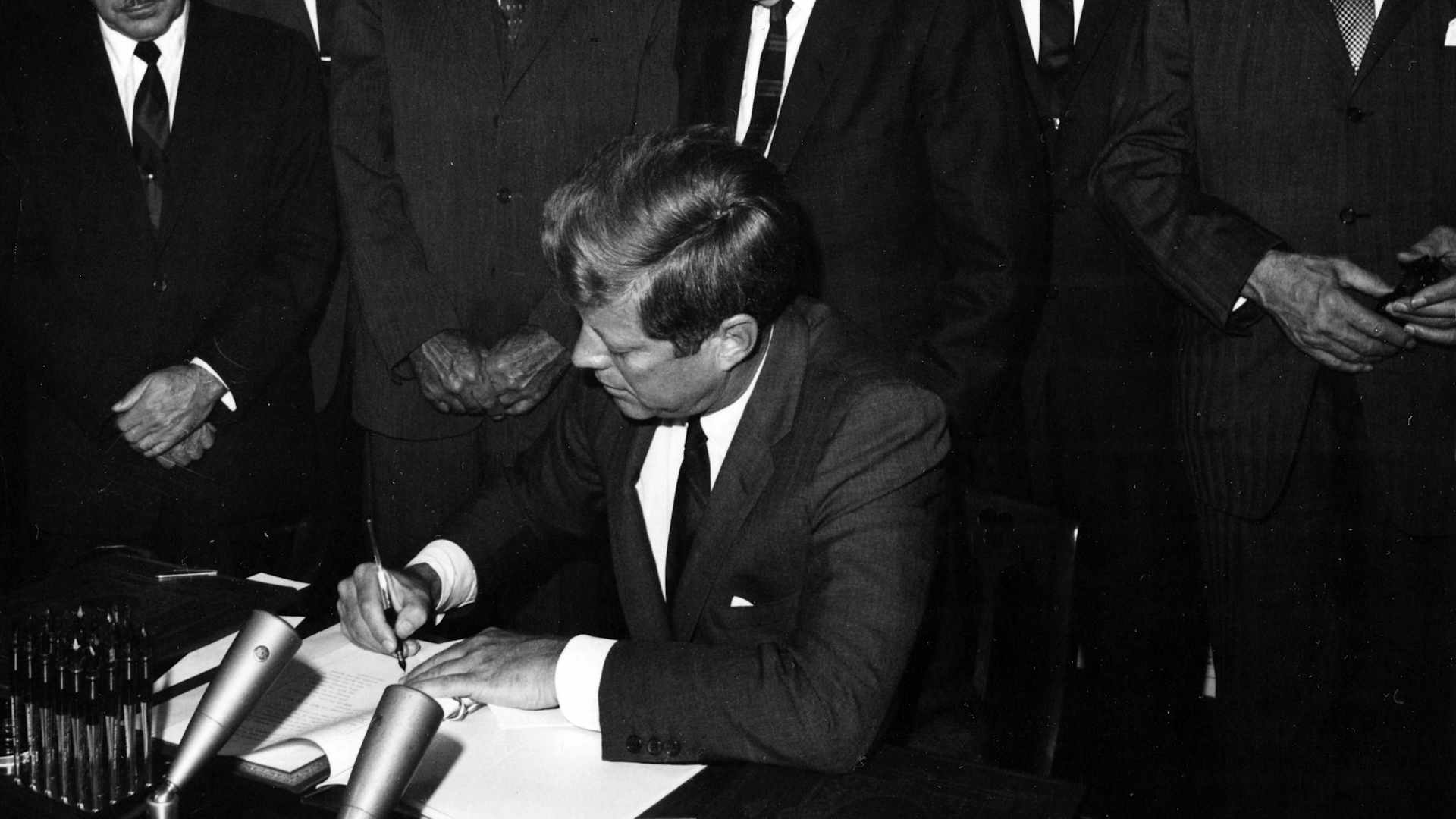 President John F Kennedy signs the instruments of ratification of the limited Nuclear Test Ban Treaty at the White House, Washington DC, October 7, 1963.