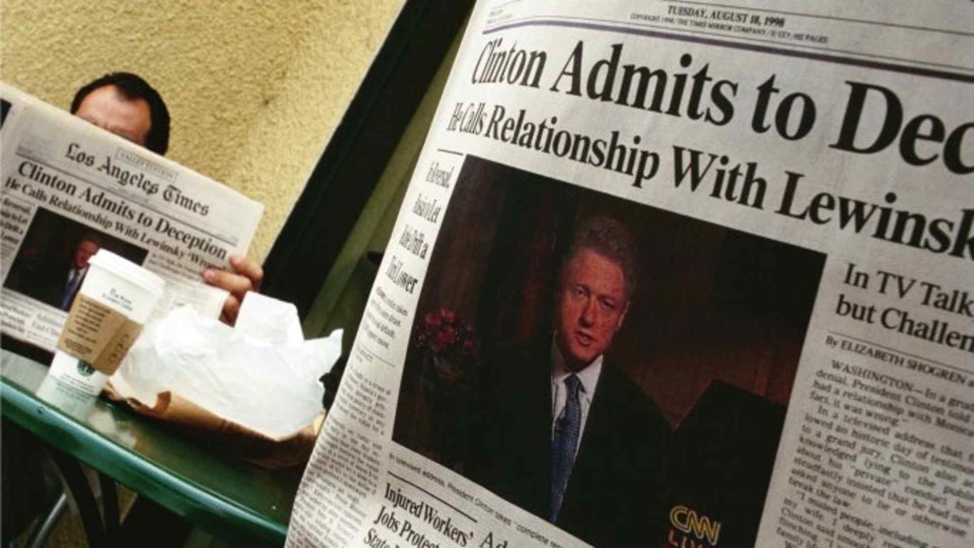 People in a California coffee shop read the Los Angeles Times the day after President Bill Clinton admitted to having a relationship with Monica Lewinsky.