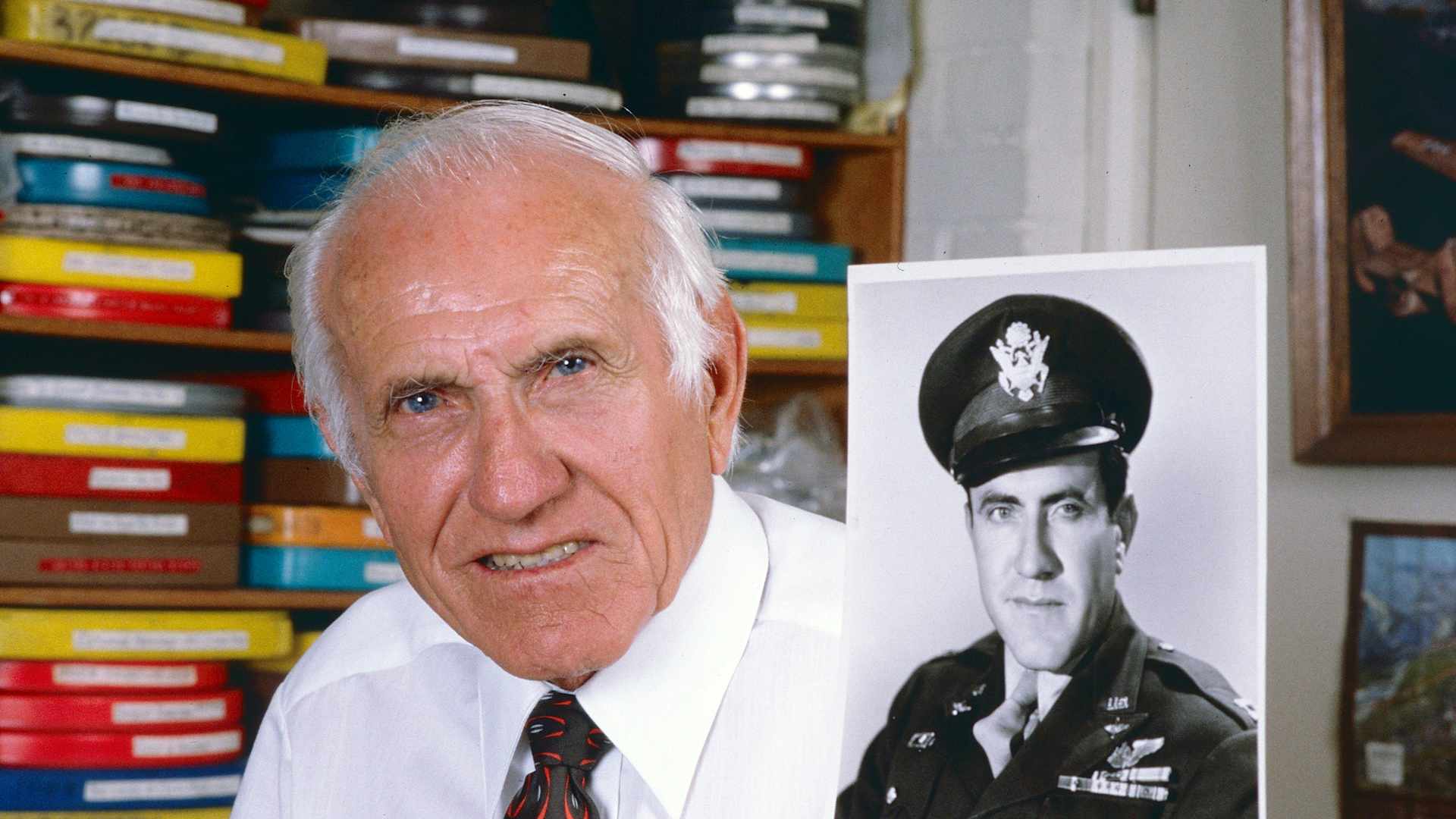 Portrait of American former bombardier (and former Olympic athlete) Lt Louis Zamperini (1917 - 2014) as he poses at home, a photo of himself during World War II in one hand, Los Angeles, California, June 13, 1985. (Photo by Bob Riha, Jr./Getty Images)