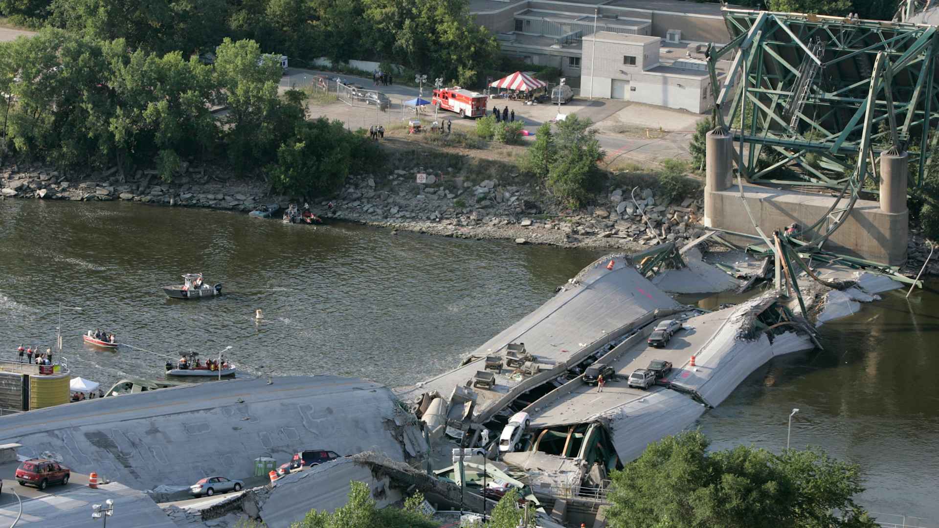 August 3, 2007. Minneapolis, Minnesota. Investigators move cautiously amid the rubble of the 35W bridge that lies in pieces in the Mississippi River.