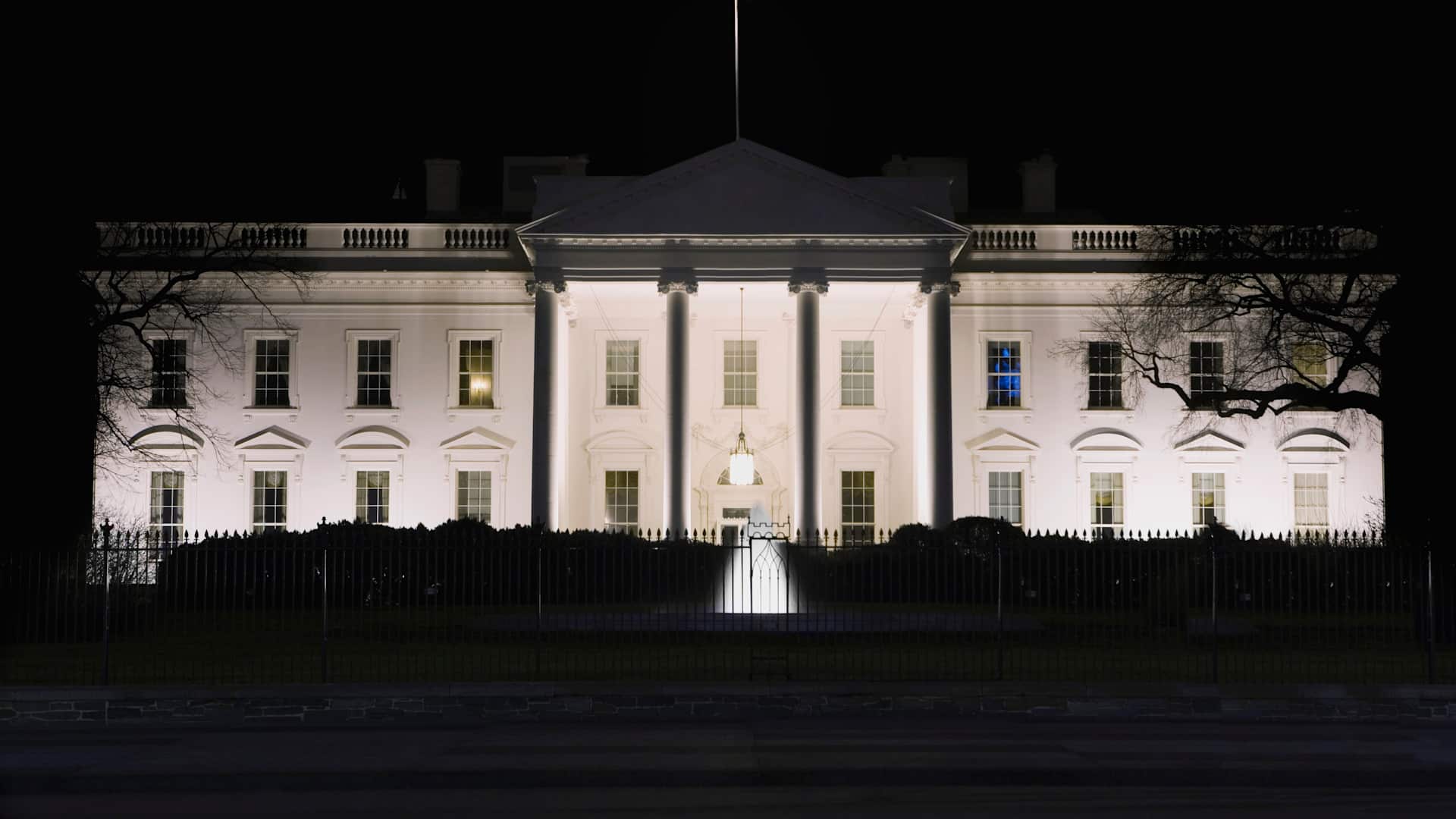 Facade of a government building lit up at night, White House, Washington DC, USA - stock photo