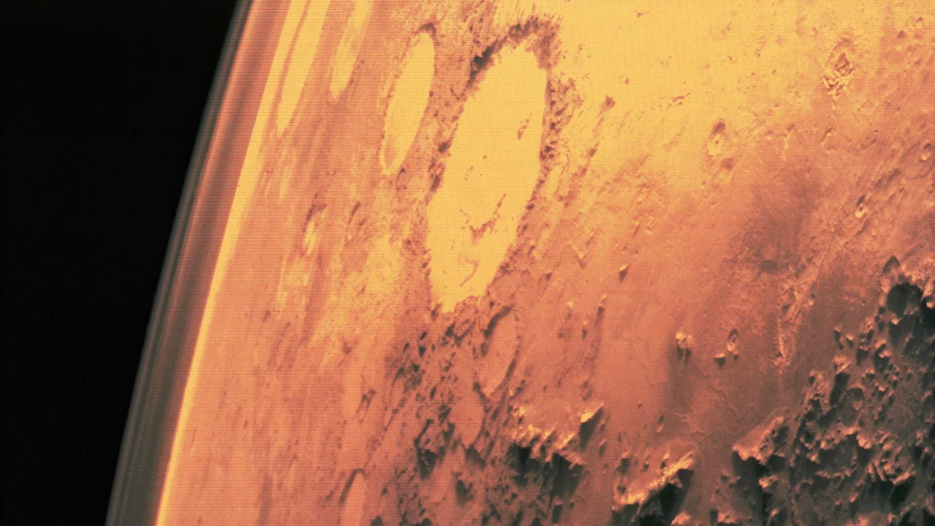 Surface of Mars, taken by Viking 1. The round areas are impact craters where asteroids have hit the planet. 1975.