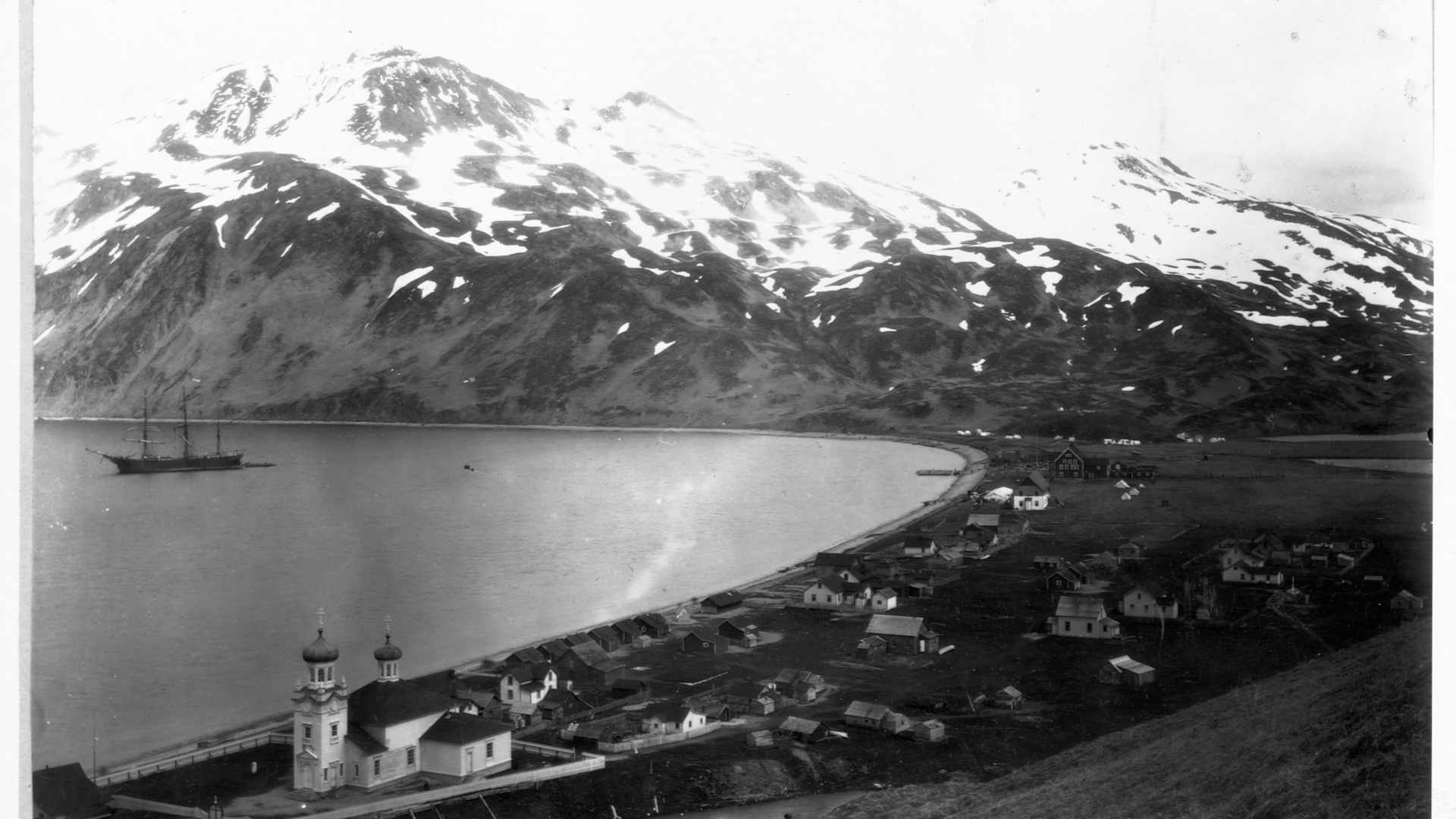 The town of Unalaska, on Unalaska Island, was founded in 1700s as the first headquarters of the Russian-American Company in Alaska. A Russian Orthodox church appears in the lower left.