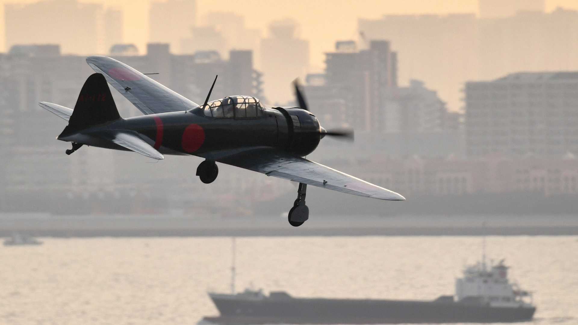 CHIBA, JAPAN - JUNE 03: A wartime Zero fighter plane flies over Tokyo Bay off Chiba on June 3, 2017 in Chiba, Japan. After the end of World War II, Zero planes flew a few times over Japanese airspace. However, all those flights were undertaken with American pilots at the controls. The Zero aircraft is a Model 22 manufactured by Mitsubishi Heavy Industries Ltd. in 1942. (Photo by The Asahi Shimbun via Getty Images)