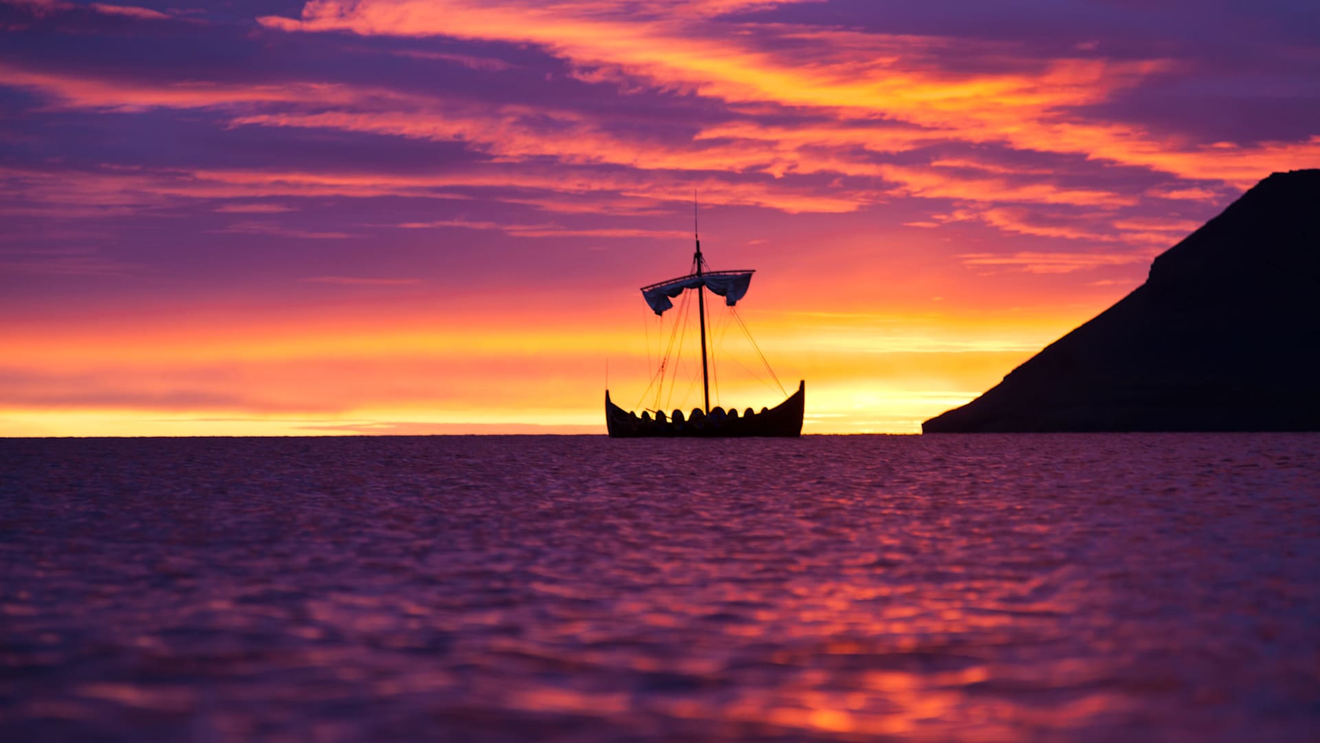 A Viking ship at sunset.