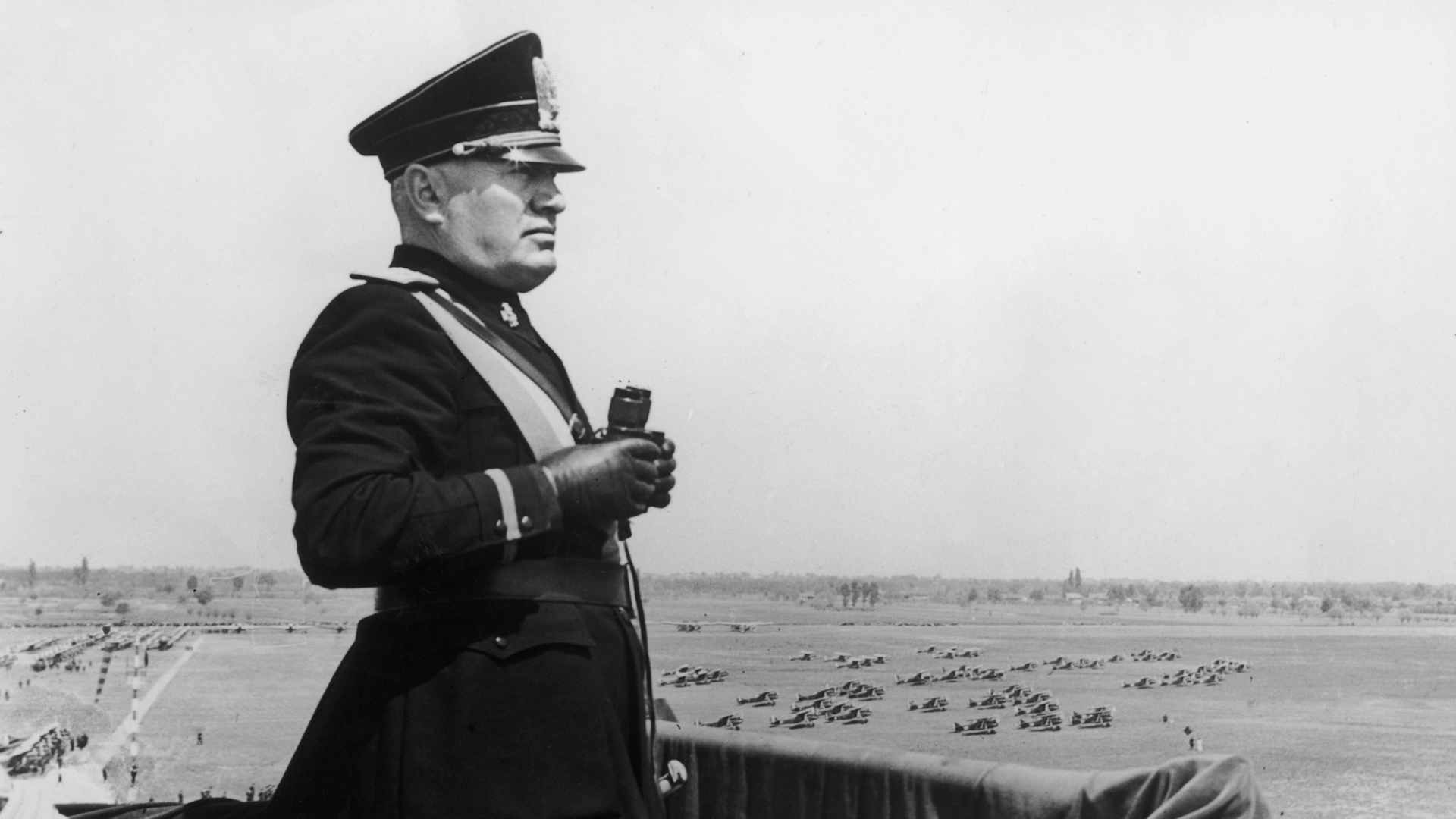 Italian dictator Benito Mussolini (1883 - 1945) surveys the new Caselle Airport during a visit to Turin in 1939.