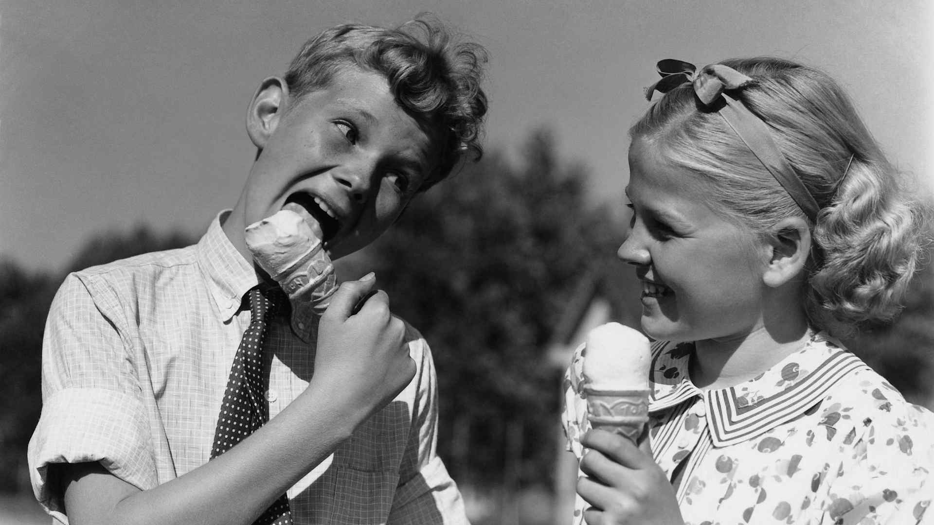 Boy and girl eating ice cream