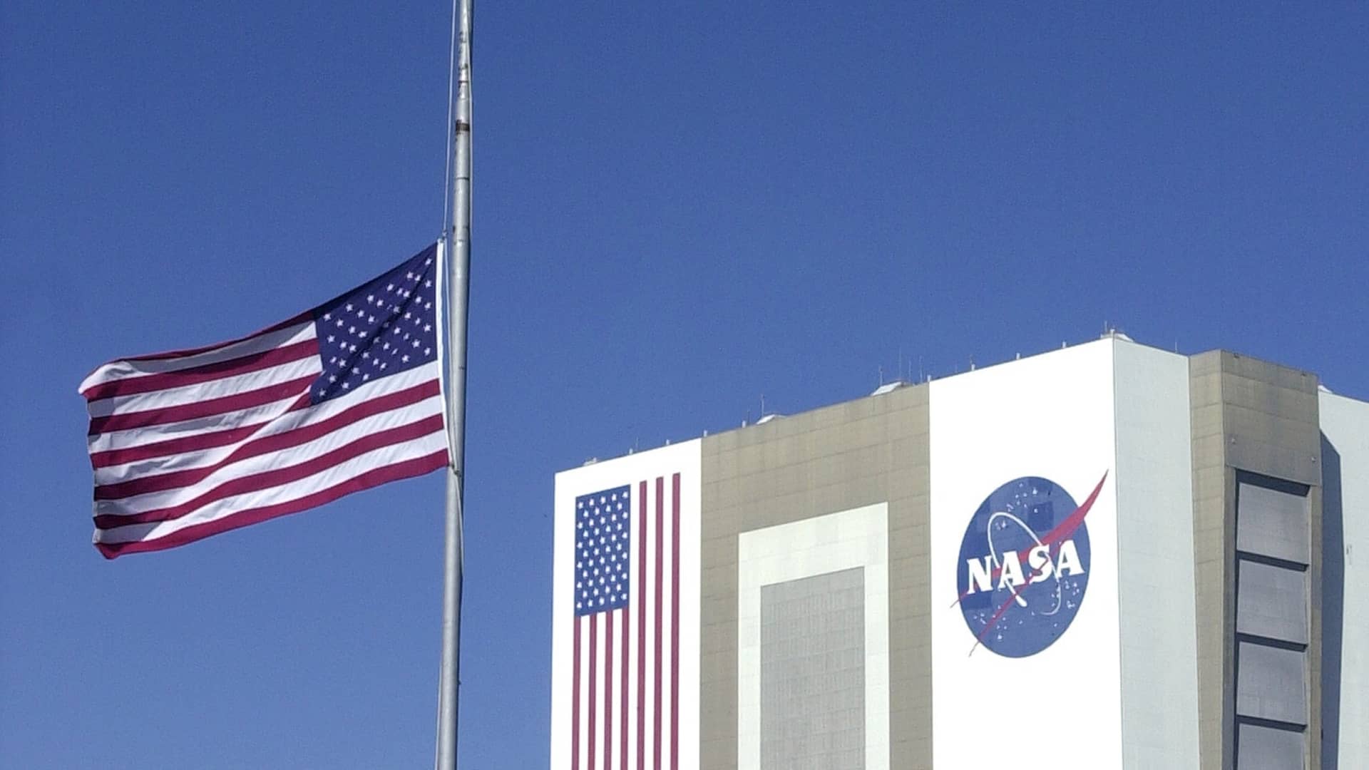 Flag flies at half-staff at the Kennedy Space Center in Cape Canaveral on the day after seven astronauts died in the explosion of the space shuttle Columbia on its way to a landing in Florida.