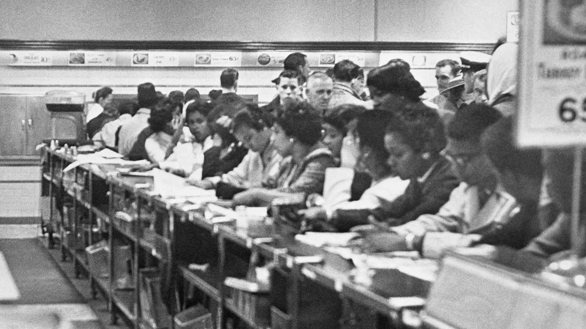 Demonstrators line the counter at the F.W. Woolworth Co.