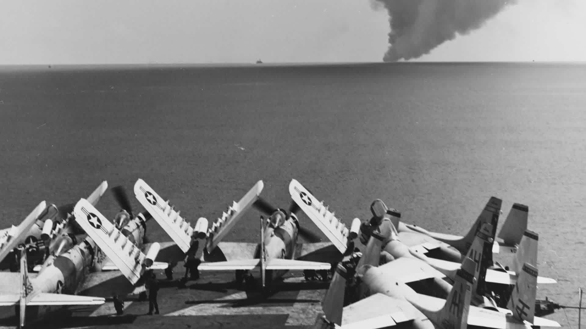 Fire On The USS ForrestalSmoke from the burning US Navy aircraft carrier USS Forrestal is visible from the flight deck of the aircraft carrier USS Oriskany, in the Gulf of Tonkin, July 29, 1967. On the USS Oriskany's deck are A-1 Skyraiders and F-8 Crusaders. (Photo by US Navy/Interim Archives/Getty Images)