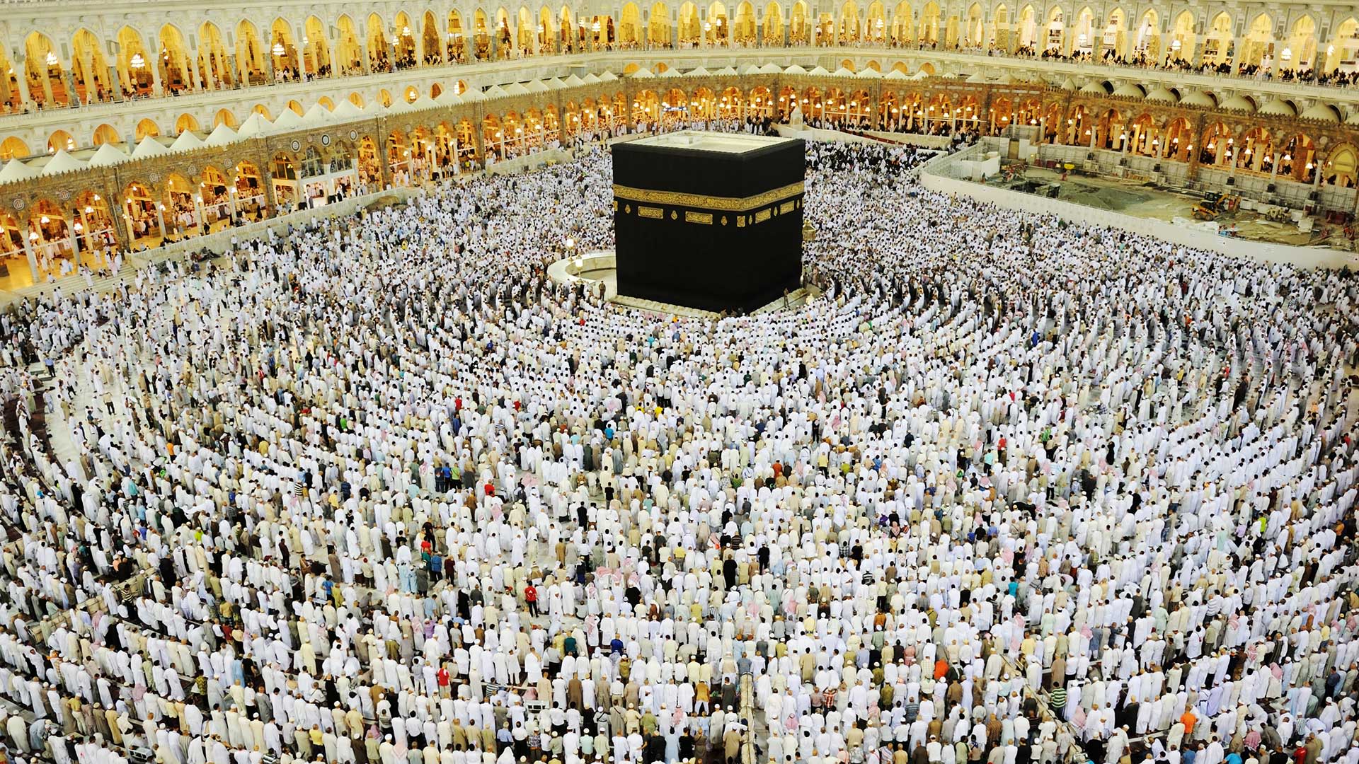 Muslim people praying around the Kaaba in Mecca.