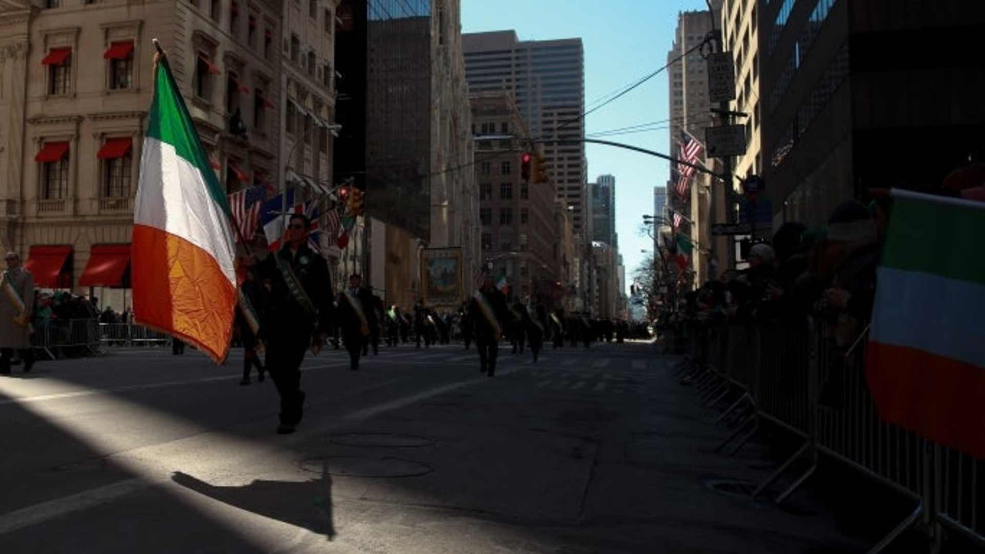 A participant of the annual St. Patrick's Day parade in New York City, which dates back to 1762, marches down 5th Avenue with an Irish flag. (Credit: Drew Angerer/Getty Images)