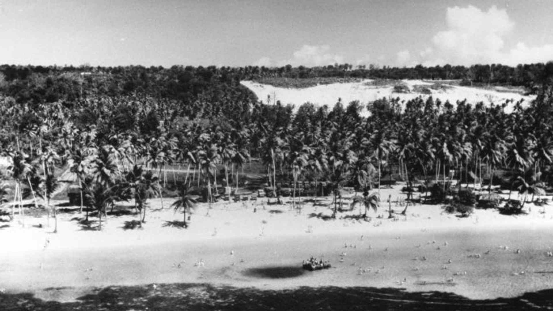 Aerial view of military personnel enjoying the beach at Tumon Bay, 1945