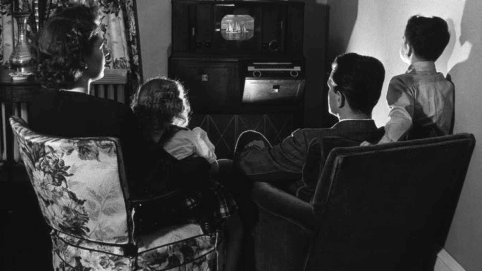A family sitting around their television, 1945. (Credit: Harold M. Lambert/Getty Images)