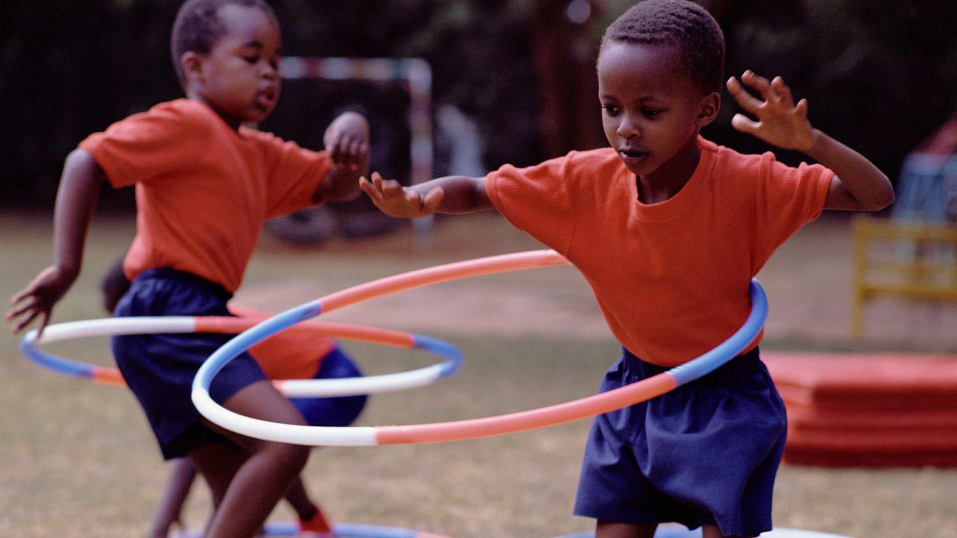Schoolboys Playing with Hula Hoop - stock photo