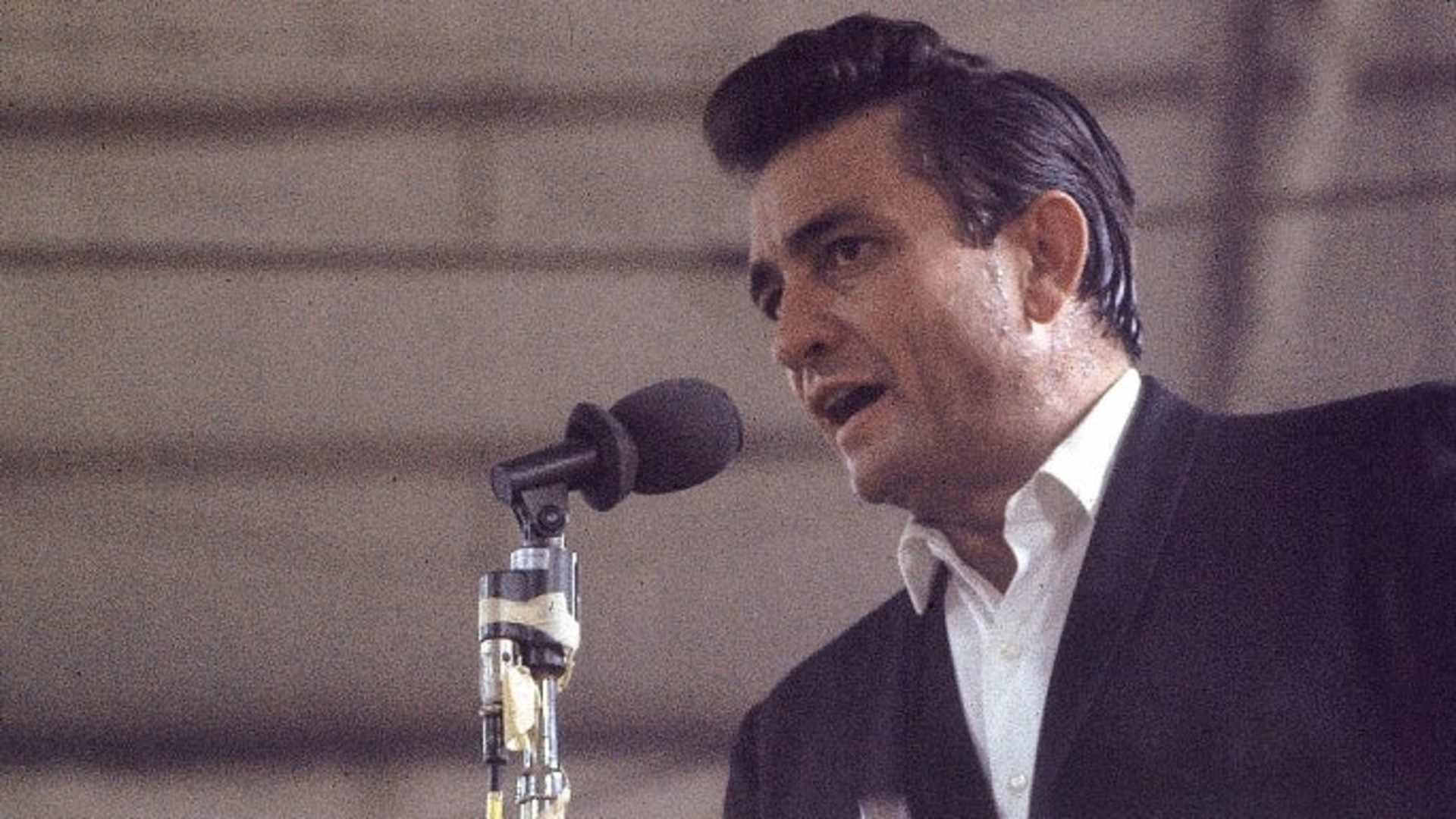 Country singer Johnny Cash performing for prisoners at the Folsom Prison in California on January 13, 1968. The performance was recorded for his live album "Johnny Cash at Folsom Prison."  (Credit: Dan Poush/AP Photo)