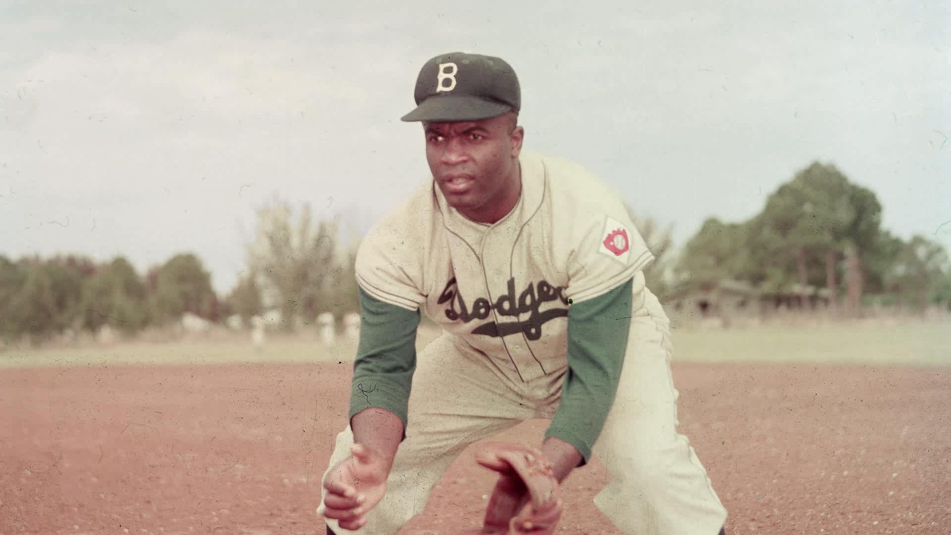 Jackie Robinson In ActionAmerican professional baseball player Jackie Robinson (1919 - 1972) of the Brooklyn Dodgers, dressed in a road uniform, crouches by the base and prepares to catch a ball, 1951. Throughout the course of his baseball career Robinson played several positions on the infield as well as serving as outfielder. (Photo by Keystone/Getty Images)