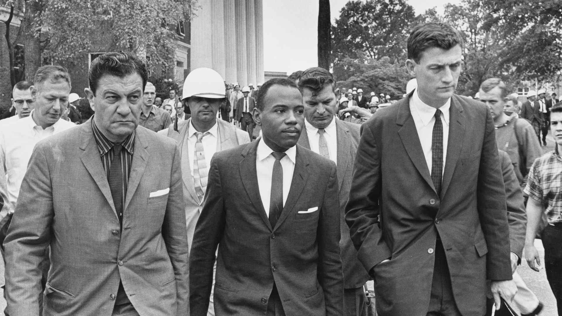 American activist James Meredith on his way to class at University of Mississippi, escorted by US Marshal James McShane, left, and John Doar of the Justice Department, Oxford, Mississippi, October 1962.