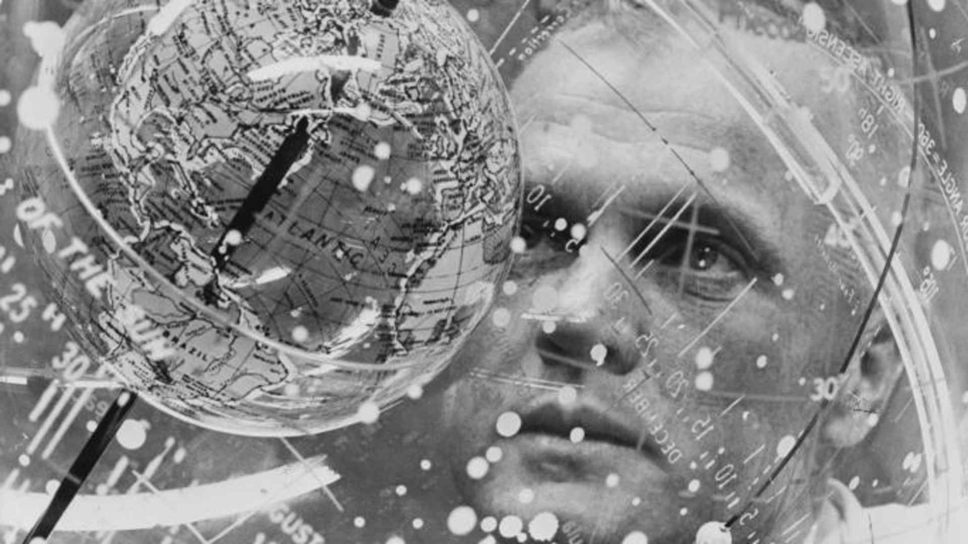 John Glenn looks into a Celestial Training Device during training in 1961.