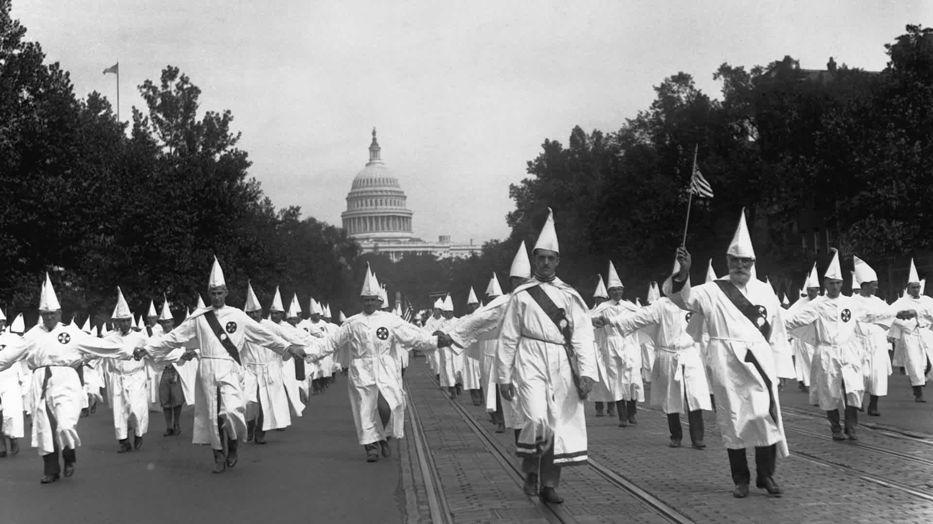 Ku Klux Klan Holding a MarchKu Klux Klan members parade down Pennsylvania Avenue from the capitol to the treasury in Washington, DC, on August 8, 1925.