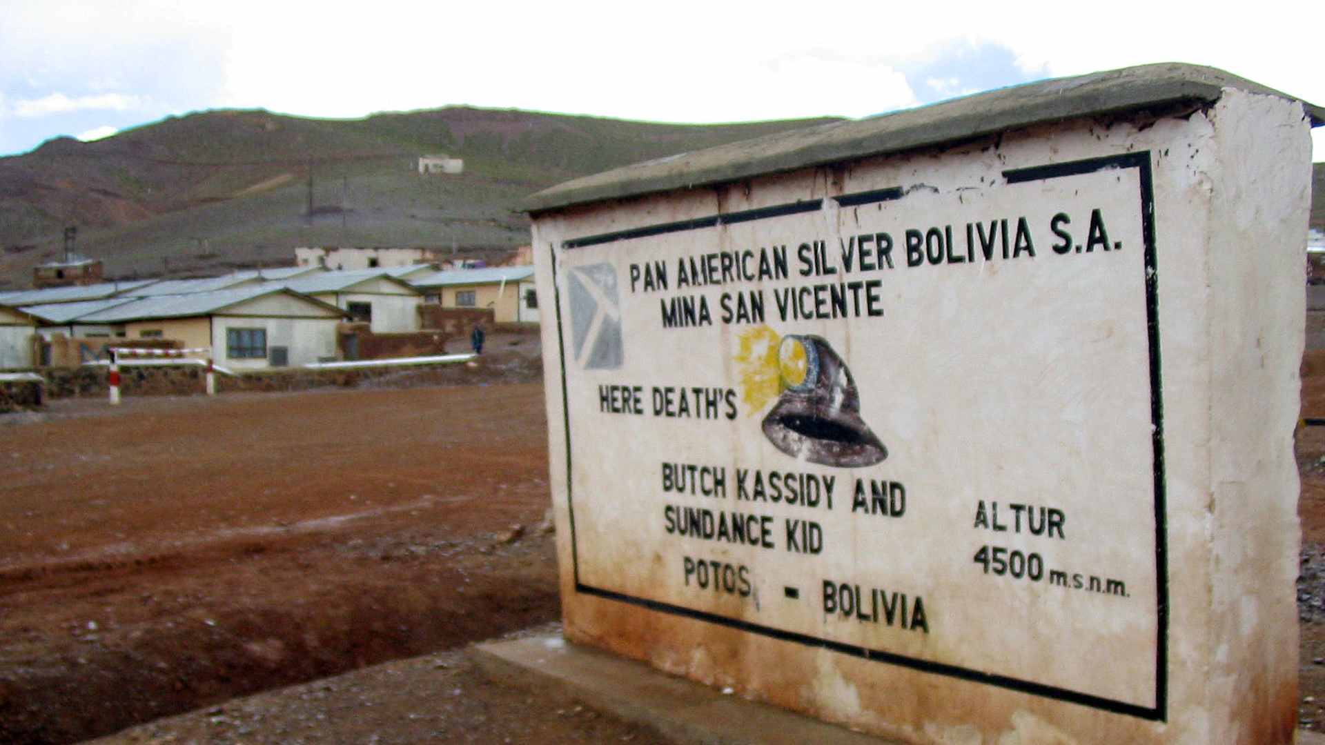 A worn, gramatically flawed marker welcomes visitors to San Vicente, Bolivia, the final resting place of Butch Cassidy and the Sundance Kid. (Photo by Tyler Bridges/Miami Herald/Tribune News Service via Getty Images)