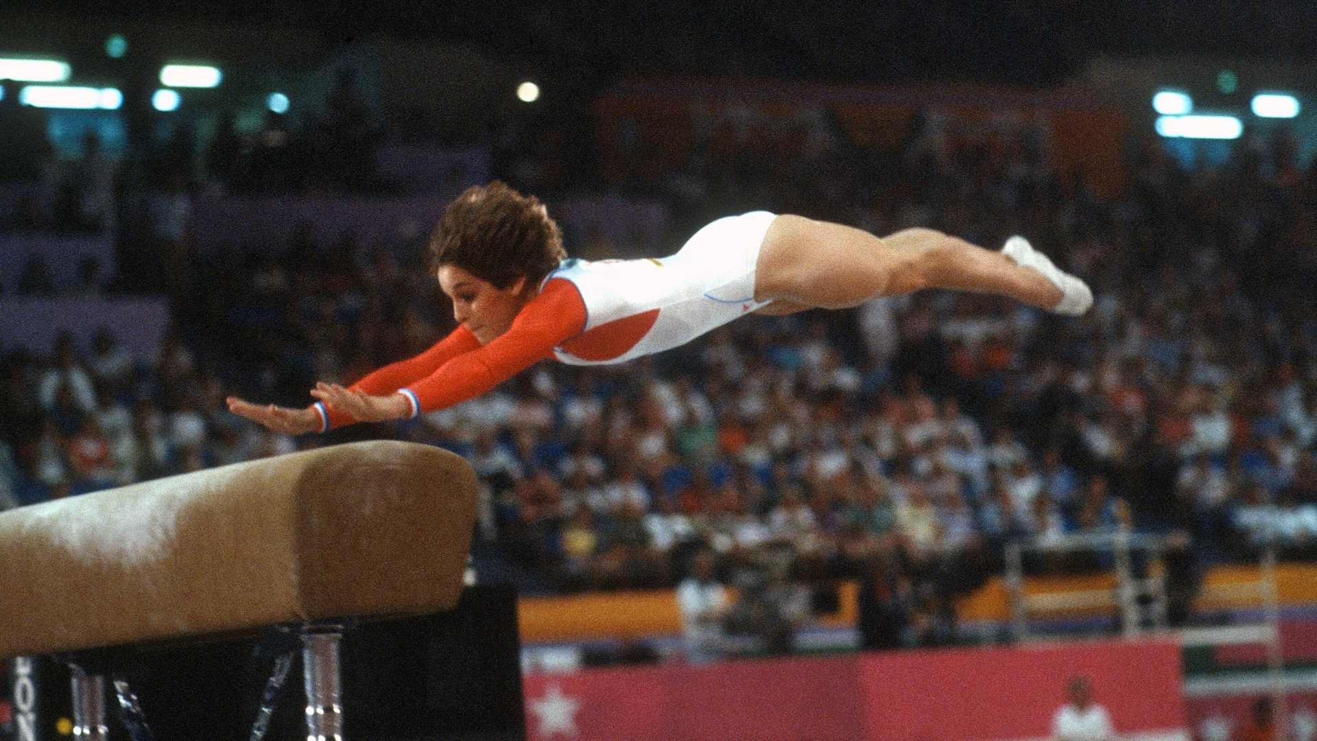 LOS ANGELES, CA - CIRCA 1984: Gymnast Mary Lou Retton of the United States competes in the vault competition in gymnastics during the Games of the XXIII Olympiad in the 1984 Summer Olympics circa 1984 at UCLA's Pauley Pavilion in Los Angeles, California. (Photo by Focus on Sport/Getty Images)