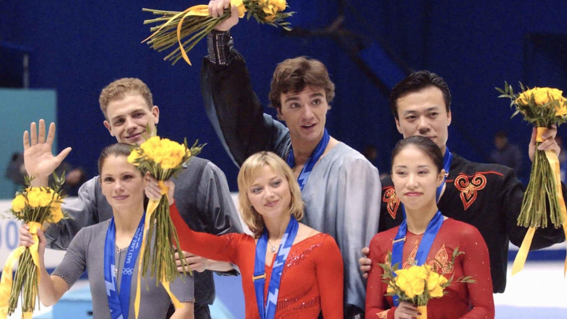 SALT LAKE CITY, UT - FEBRUARY 11: Silver medalists Jamie Sale and David Pelletier of Canada, gold medalists Elena Berezhnaya and Anton Sikharulidze, bronze medalists Shen Xue and Zhao Hongbo of China pose on the podium at the medal ceremony for the Figure Skating Pair during day three of the Salt Lake City Olympics at the Salt Lake Ice Center on February 11, 2002 in Salt Lake City, Utah. (Photo by The Asahi Shimbun via Getty Images)