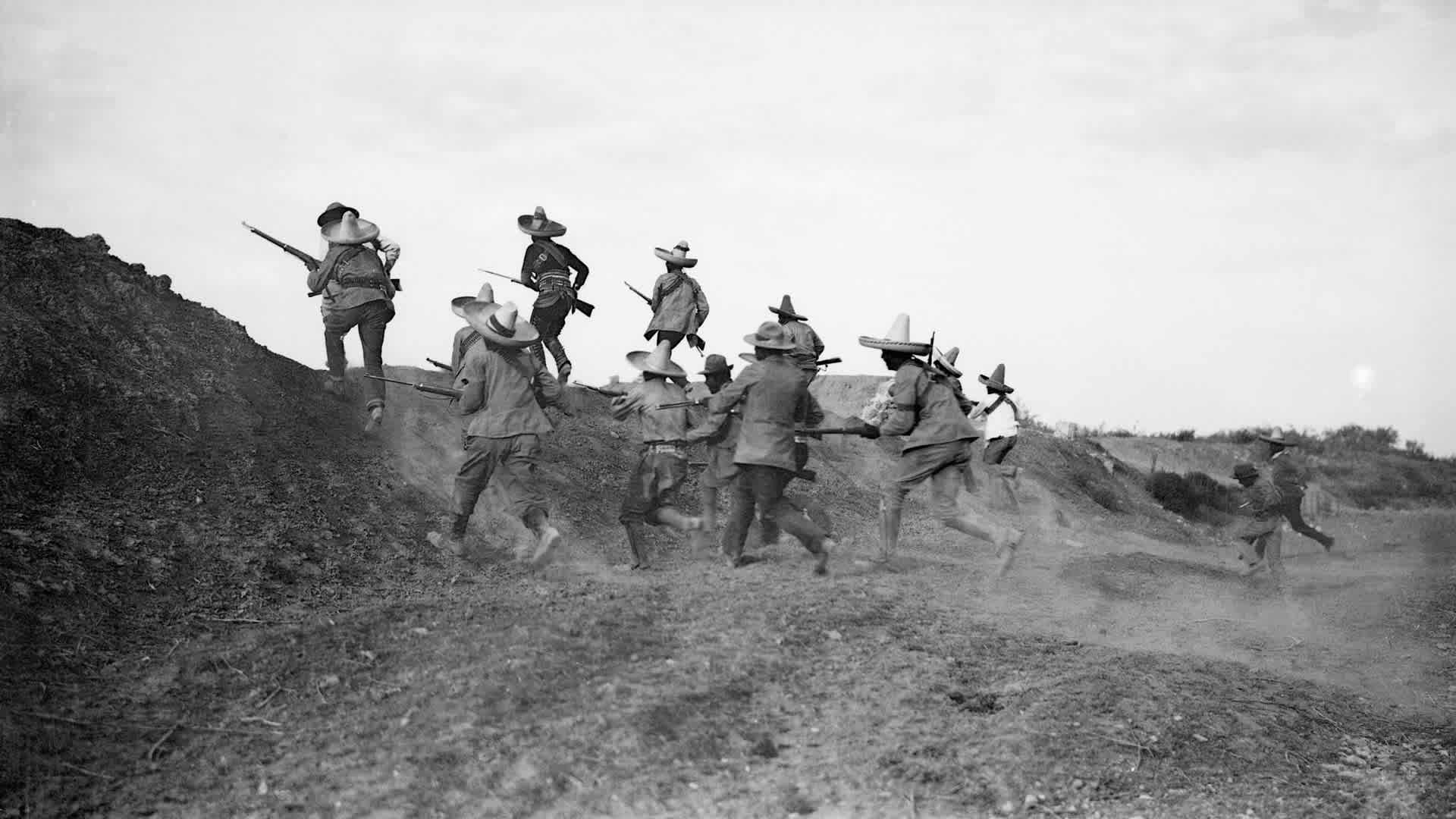 Pancho Villa's Troops Running Up Hill(Original Caption) 11/1913-Mexican Revolution of November, 1913. Photo shows Pancho Villa's troops rushing the federal lines under protection of cannon fire.