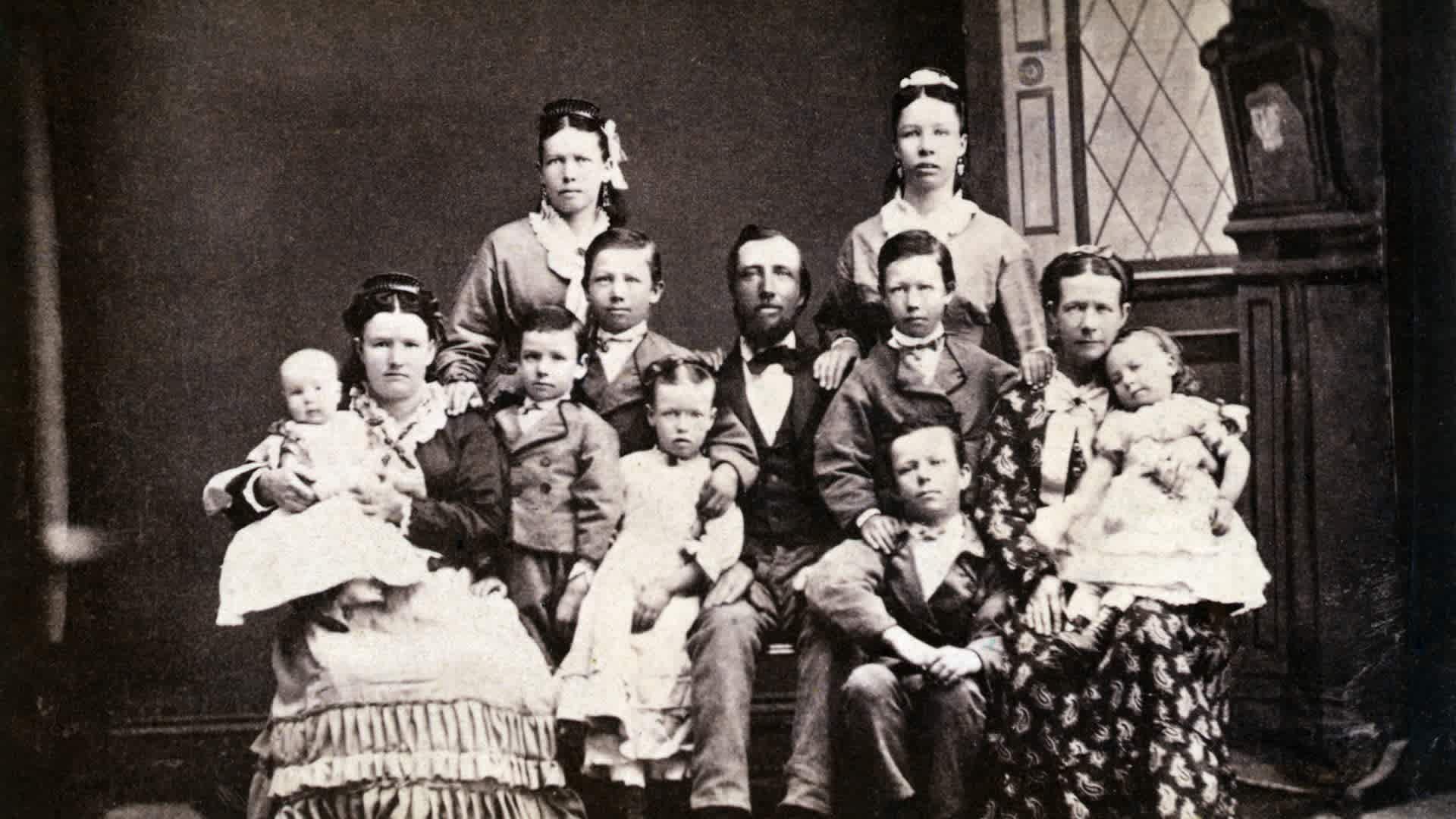 Mormon Family with Two Wives and Nine Children (Original Caption) Mormons. Typical Mormon family, PA. Two wives and nine children. Photograph of the 1870's.