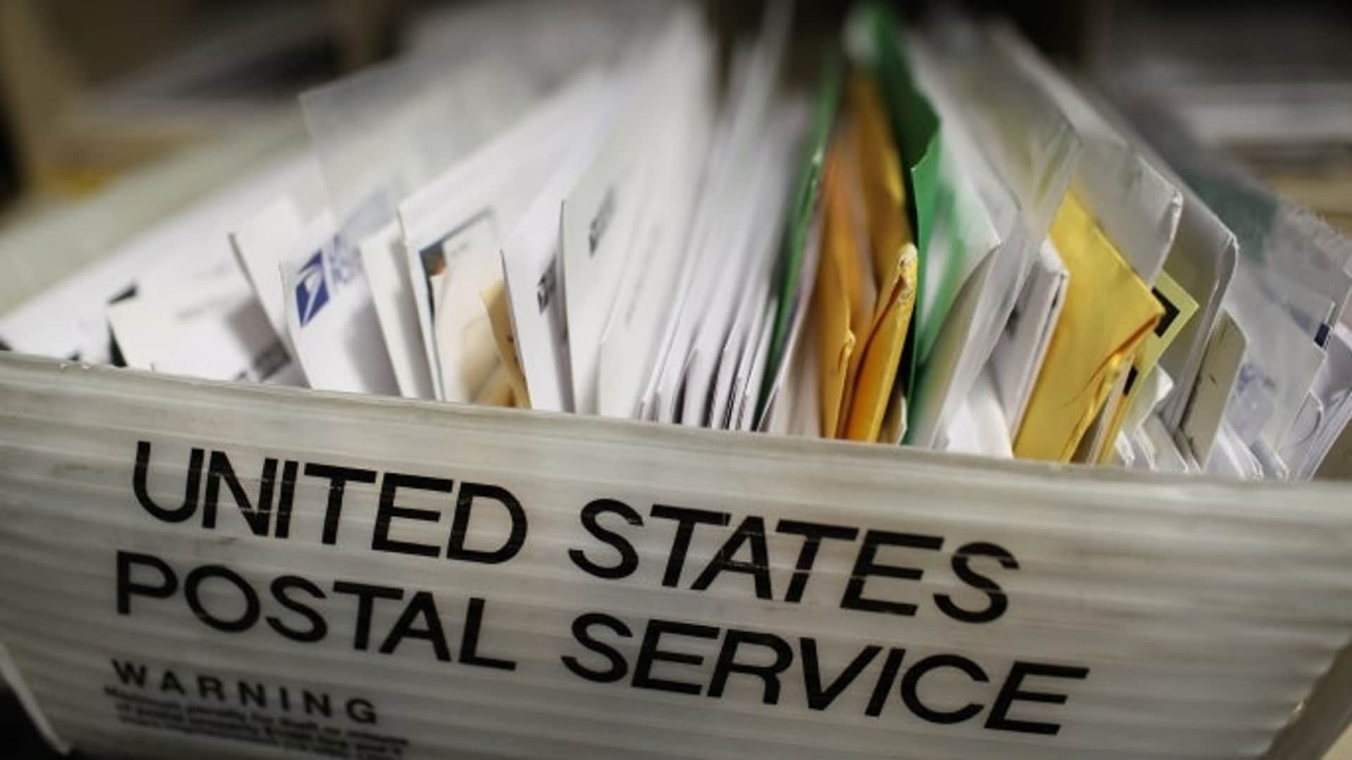 SAN FRANCISCO, CA - AUGUST 12:  Cartons of mail ready to be sorted sit on a shelf at the U.S. Post Office sort center on August 12, 2011 in San Francisco, California.  The U.S. Postal Service is proposing to lay off 120,000 workers in order to deal with an $8.5 billion loss this year that has the agency close to insolvency. The layoffs, if approved by Congress, would take place over the next three years.  In addition to layoffs, the Postal Service also wants to eliminate 100,000 jobs through attrition.  (Photo by Justin Sullivan/Getty Images)
