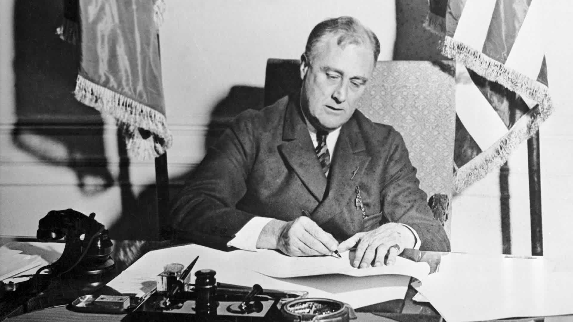 Franklin Roosevelt Signing the Emergency Banking Act.
