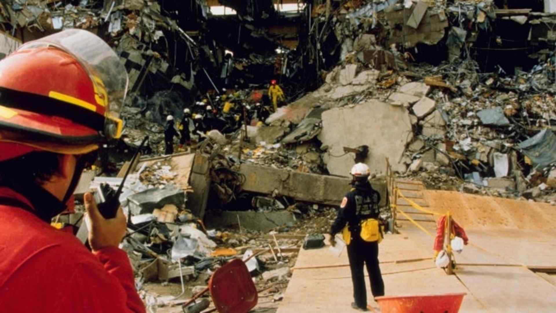 Relief workers and investigators looking through the rubble after the Oklahoma City bombing. (Credit: Greg Smith/REA/Redux)