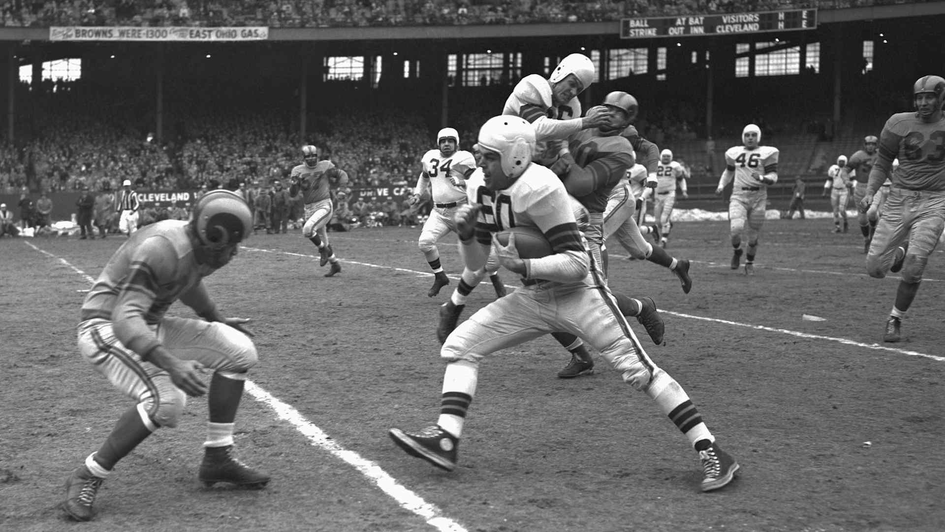 Quarterback Otto Graham of the Cleveland Browns, one of the top passers in football history, was an adept runner, too.