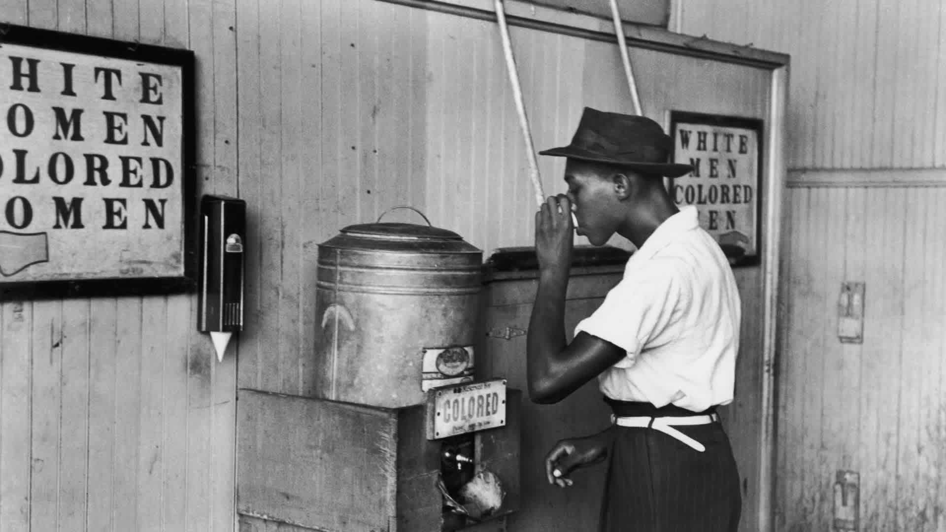 Segregated FountainJuly 1939: An African-American man drinking at a segregated drinking fountain in Oklahoma City, Oklahoma. (Photo by Russell Lee/Library Of Congress/Getty Images)