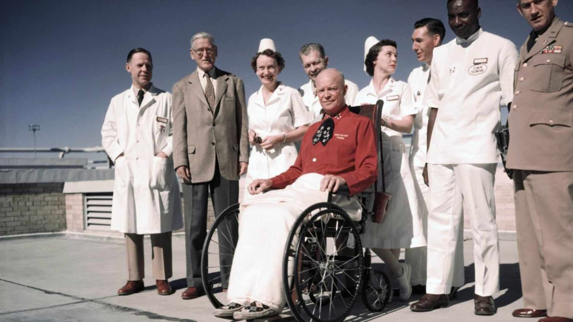 President Eisenhower posing for first pictures since his heart attack. His red shirt reads "Much Better Thanks" over the pocket. (Credit: Bettmann Archive/Getty Images)
