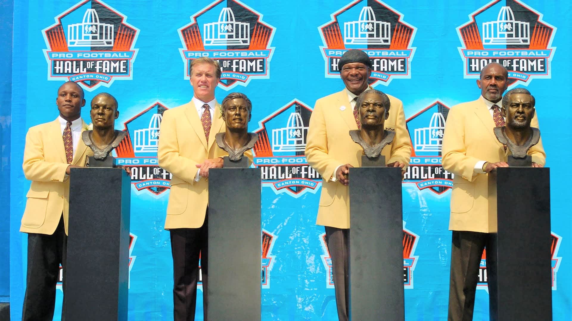 CANTON, OH - AUGUST 8: (L-R) Pro Football Hall of Fame enshrinees Barry Sanders of the Detroit Lions, John Elway of the Denver Broncos, Carl Eller of the Minnesota Vikings and Seattle Seahawks, and Bob Brown of the Philadelphia Eagles, Los Angeles Rams, and Oakland Raiders pose with their busts during the 2004 NFL Hall of Fame enshrinement ceremony August 8, 2004 in Canton, Ohio. (Photo by David Maxwell/Getty Images)