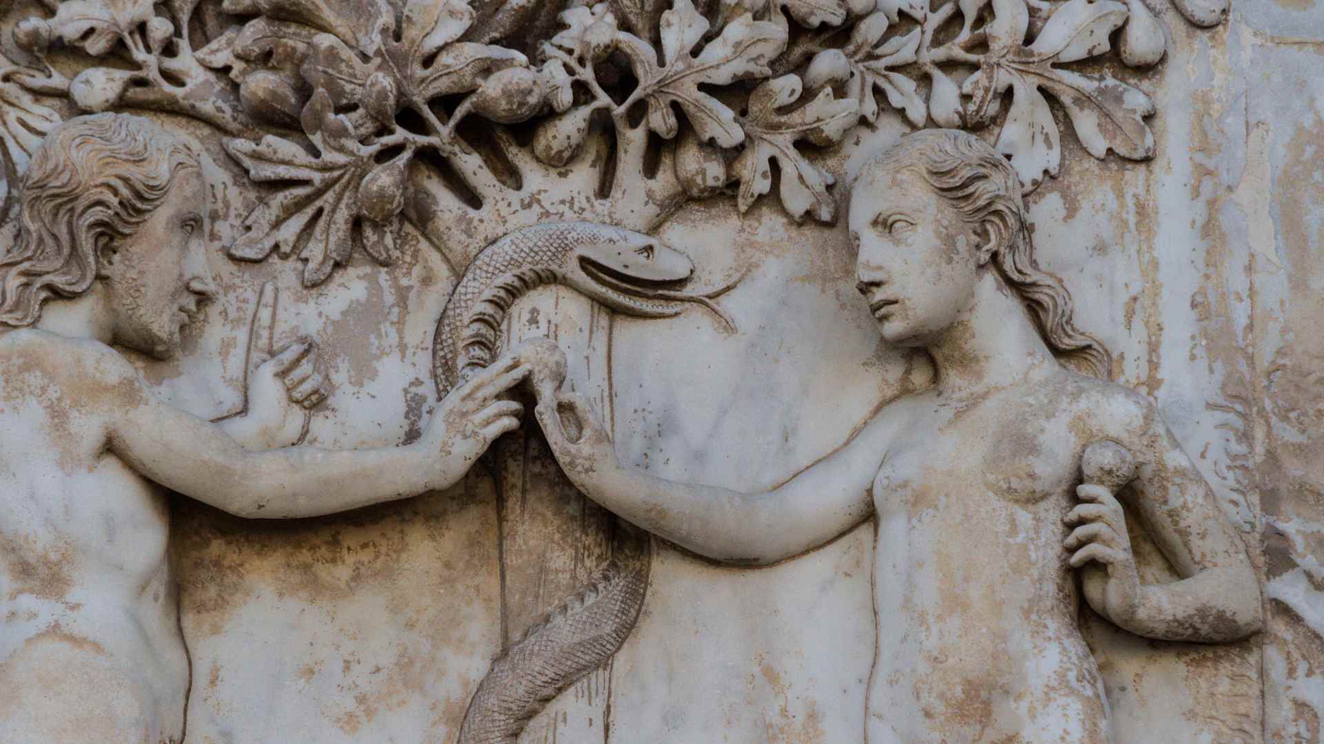Eve offering the forbidden fruit to Adam, detail of bas-reliefs on the facade of Orvieto cathedral, Umbria, Italy, 13th-14th century