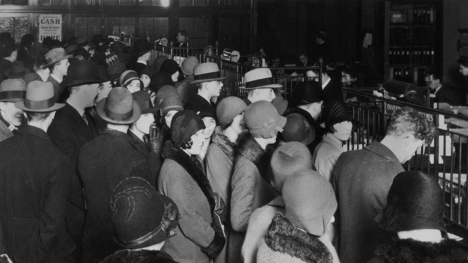 Investors rush to withdraw their savings during the stock market crash of 1929.
