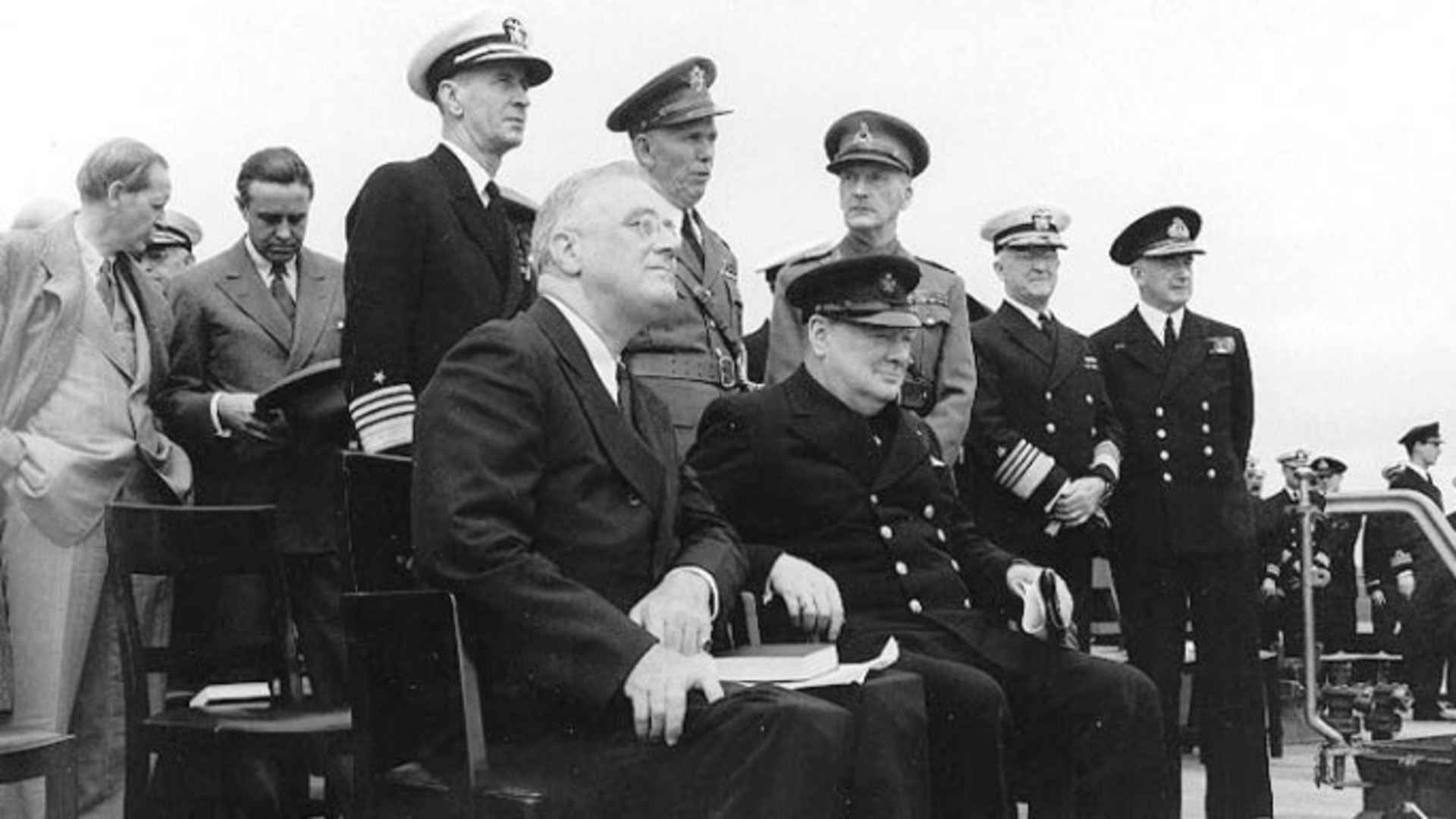 President Franklin D. Roosevelt (left) and Prime Minister Winston Churchill during Church services on the after deck of HMS Prince of Wales, during the Atlantic Charter Conference. (Credit: U.S. Navy)